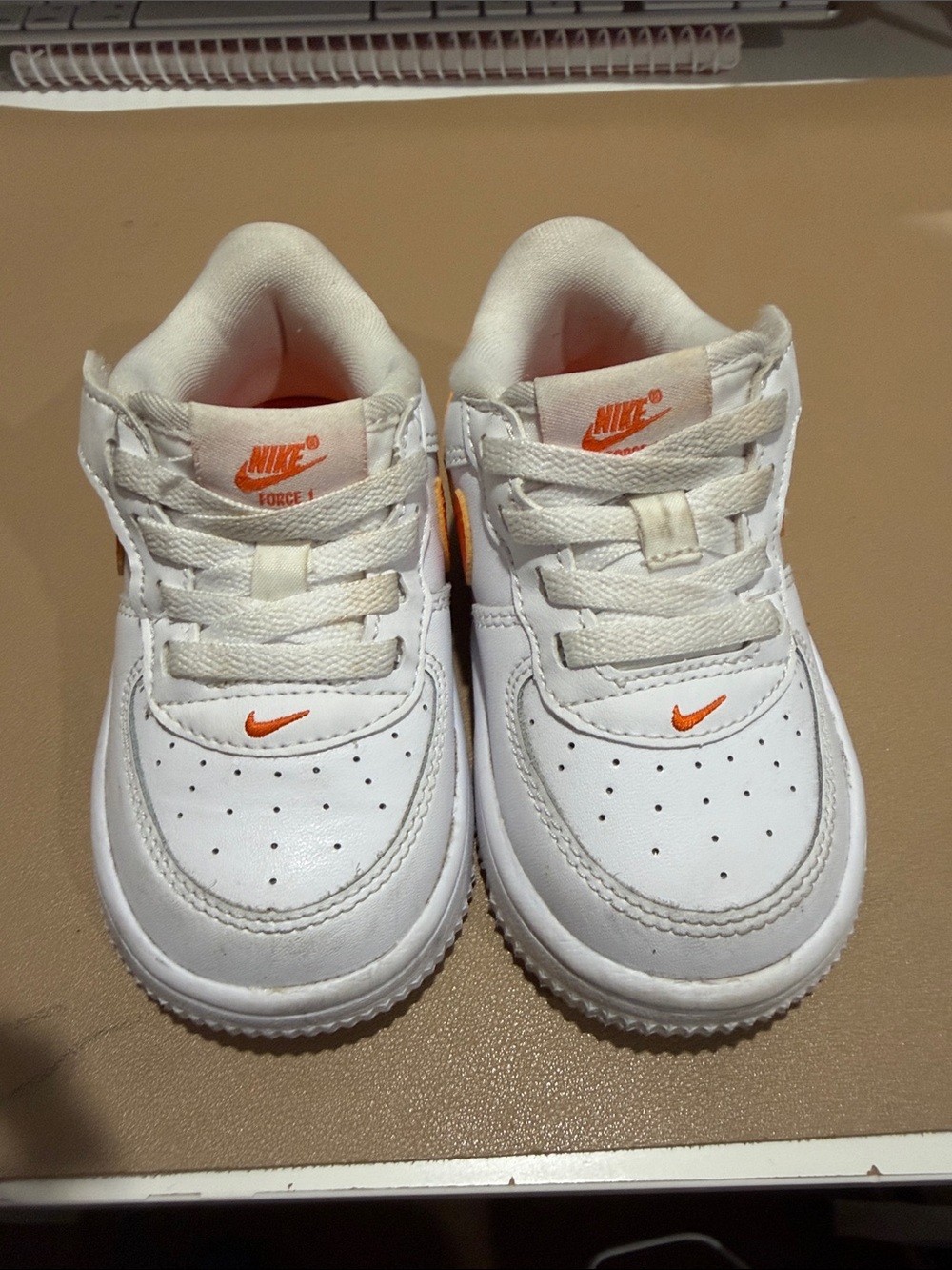 Nike Kids White Sneakers with Orange Swoosh